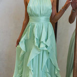 Vestido maxi con escote halter y volantes de caída fluida